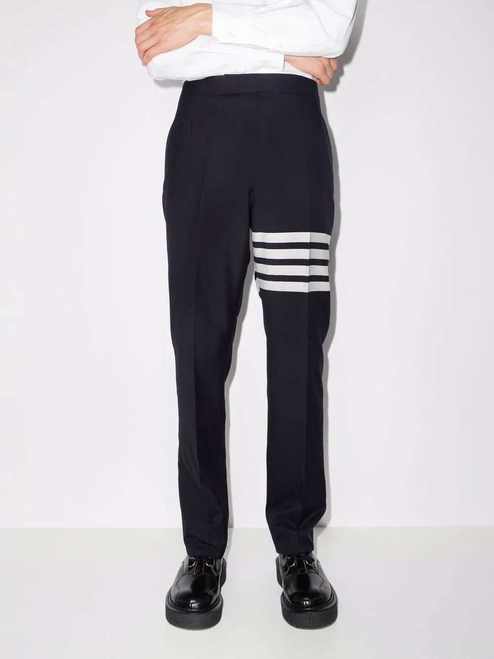 Thom Browne Classic Backstrap Trouser in black with white 4-bar stripe detail at the thigh, slim straight-leg silhouette