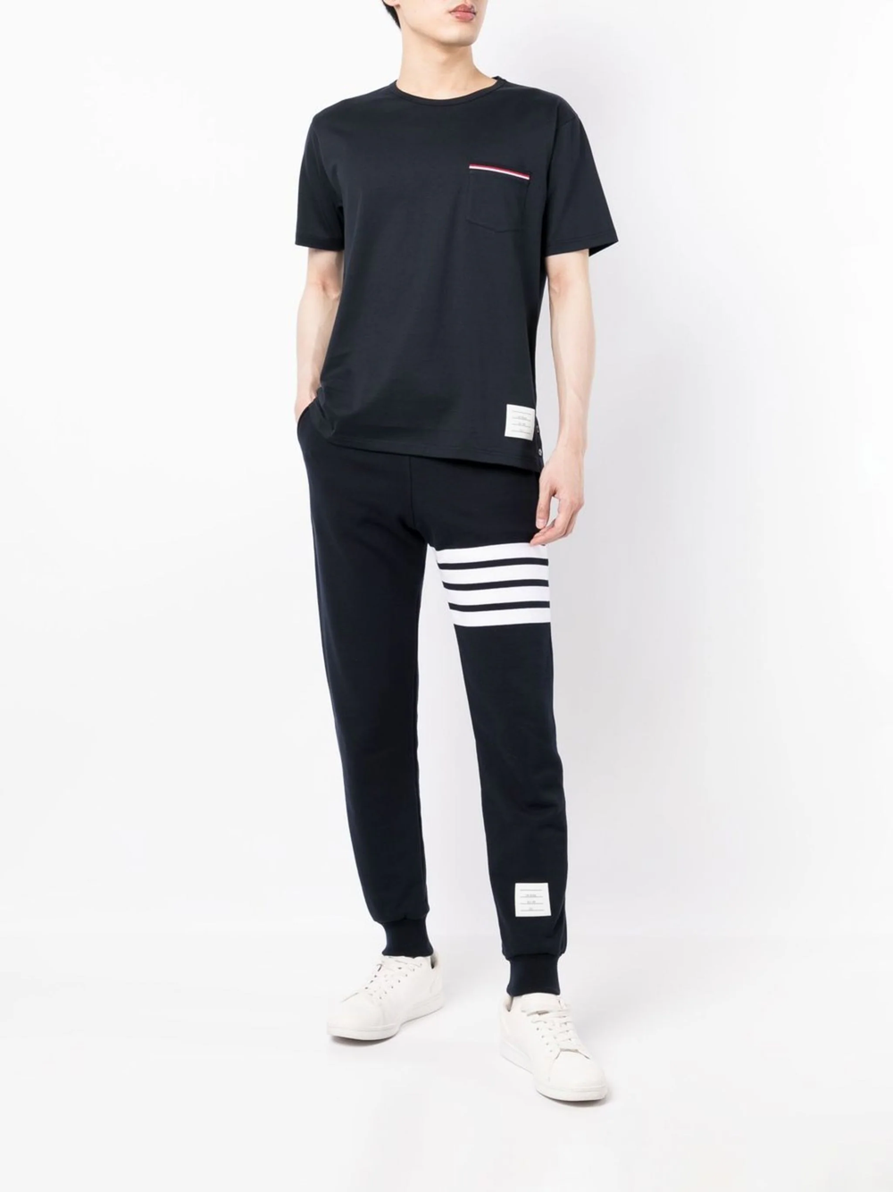 Thom Browne grey marl crew-neck pocket T-shirt with red, white, and blue stripe trim on chest pocket and branded tab at hem
