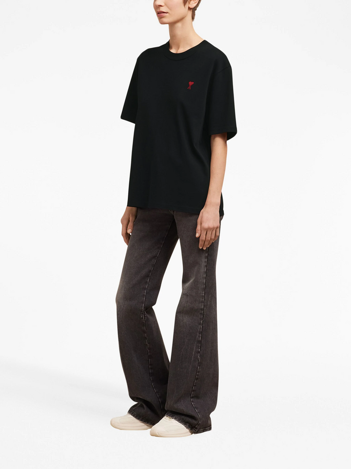AMI Paris De Coeur Boxy Fit T-Shirt in black with red embroidered heart logo on chest, flat lay on white background