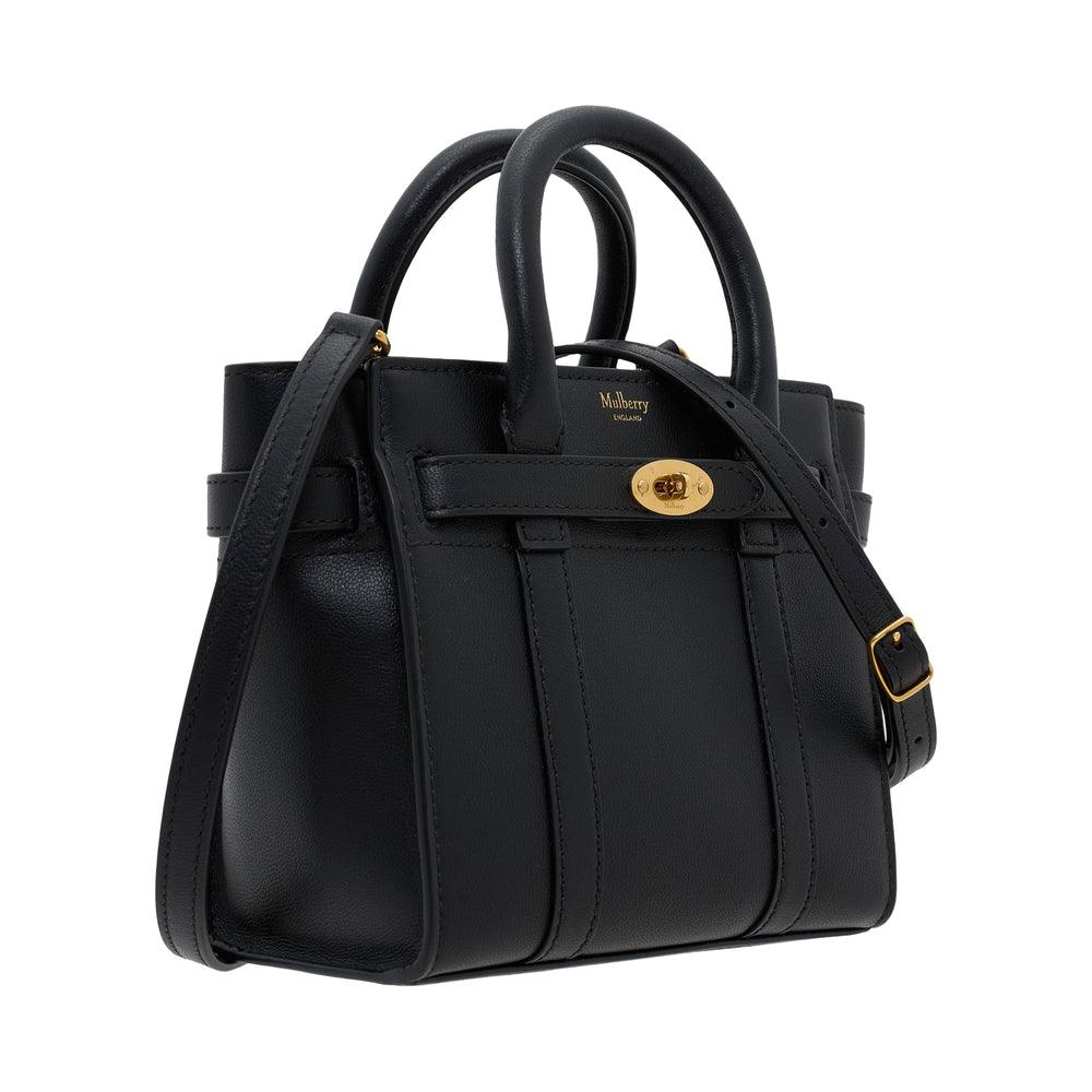 Mulberry Micro Zipped Bayswater mini bag in black pebbled leather with gold postman's lock hardware, dual rolled top handles, and detachable crossbody strap