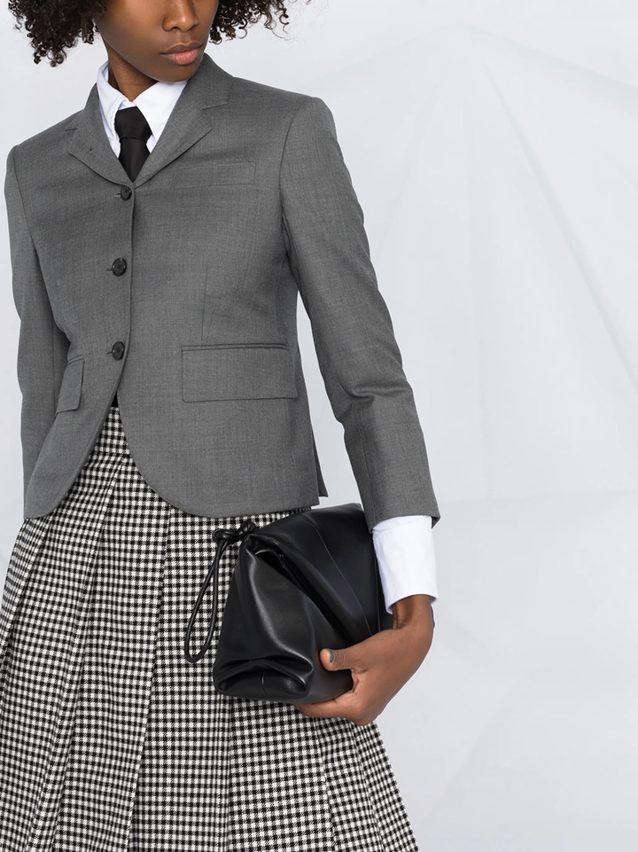 Thom Browne grey twill high armhole sport coat for women with three-button closure, notch lapels, and signature striped interior lining