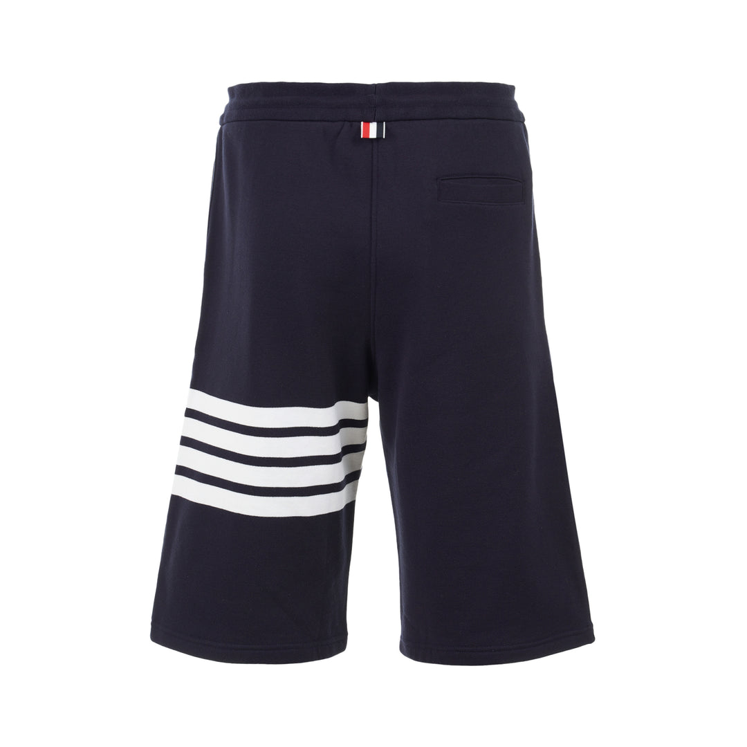 Thom Browne navy cotton sweat shorts with drawstring waist, white 4-Bar stripe on one leg and woven label patch at the hem - view 2