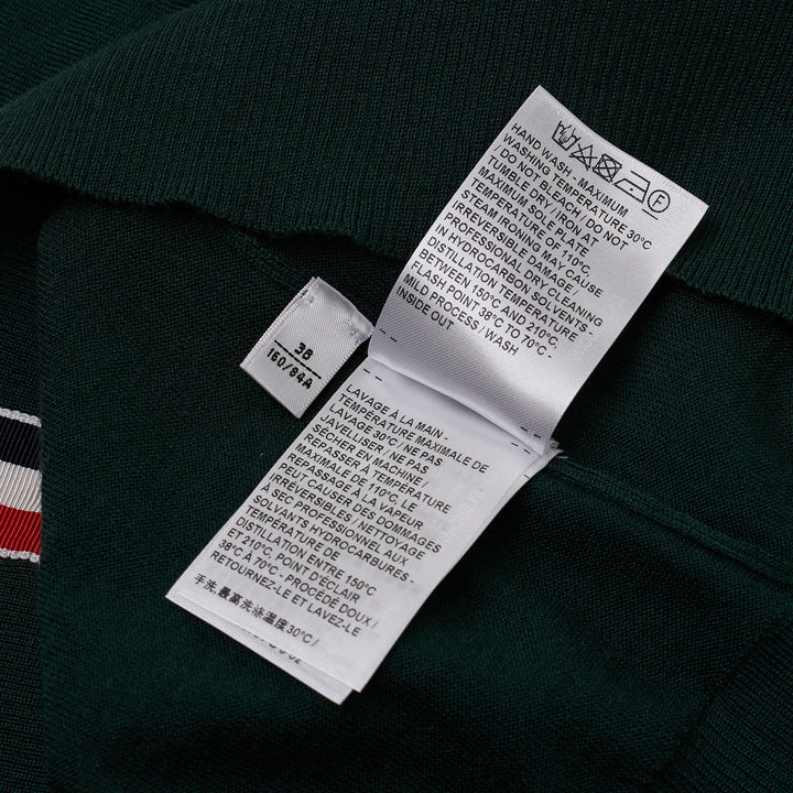 Thom Browne hunter green fine-knit polo with four-bar white stripe on sleeve, button placket, ribbed cuffs and hem