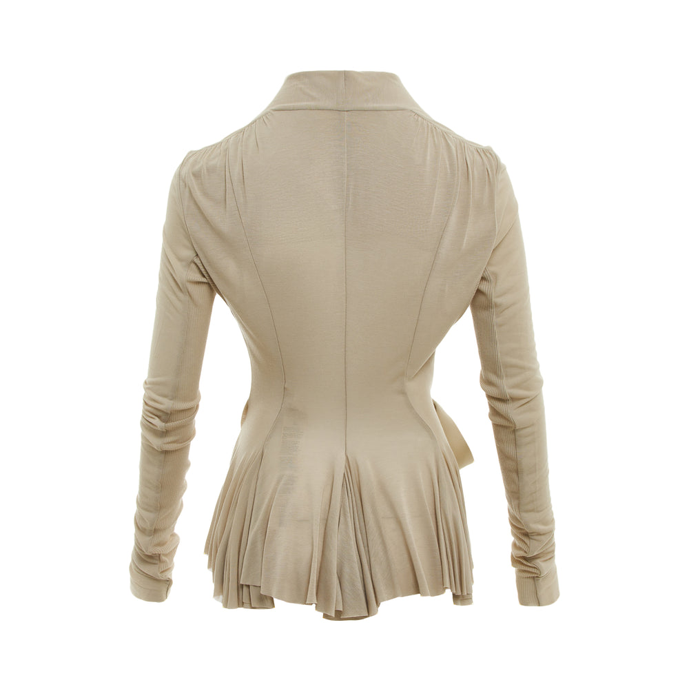 Rick Owens Hollywood wrap jacket in sandy beige with shawl collar, tie waist sash, long gathered sleeves, and a fluid asymmetric hem, displayed on a white background