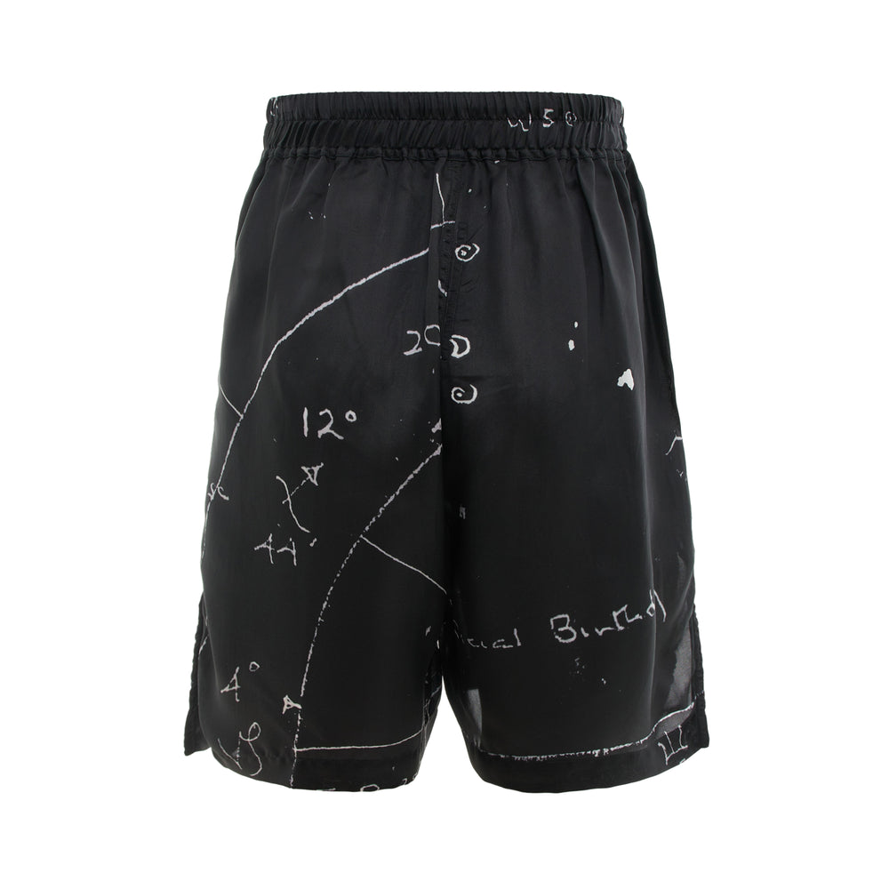 Rick Owens black boxer shorts with all-over white celestial star-chart print, elasticated waistband, and braided drawstring tie