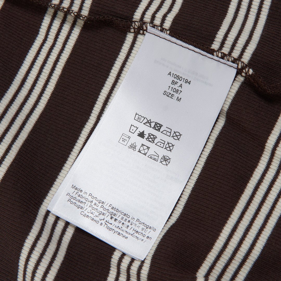GANNI Striped Ribbed Long Sleeve Top in dark brown and cream horizontal stripes with crew neckline and fitted silhouette