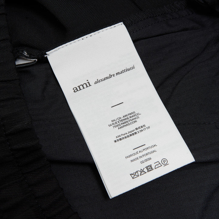 AMI Elasticated Waist Wide Leg Trousers in black with smocked waistband and drawstring tie