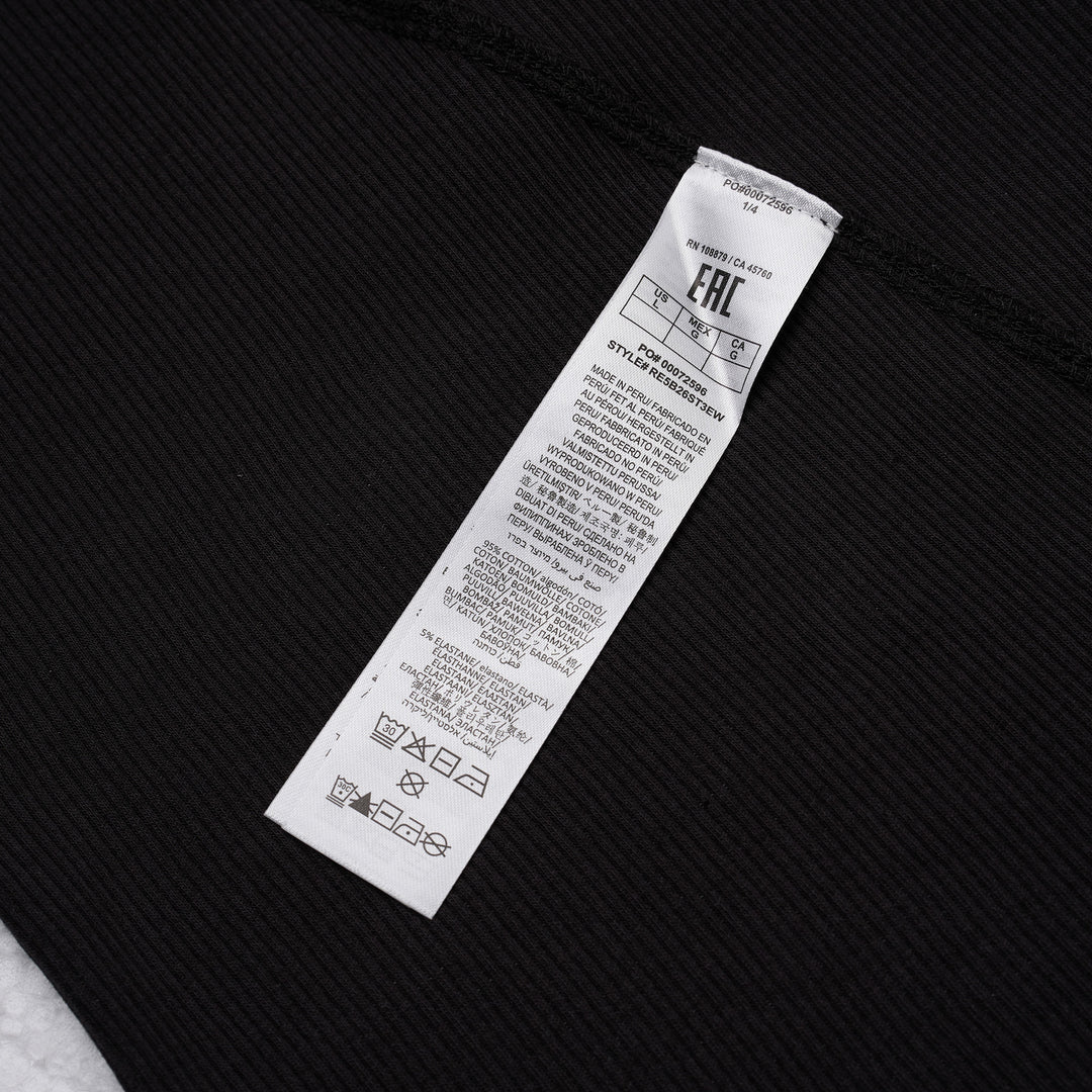 rag & bone Essential Rib Muscle Tank in black, featuring a high racer neckline, fine ribbed knit fabric, and a form-fitting sleeveless silhouette, shown on a flat lay against a white background