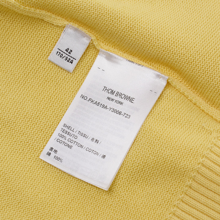 Thom Browne Short Sleeve Intarsia Knit Tee in baby pink with signature 4-bar cream stripe on the sleeve and contrast cream crew neckline, front view