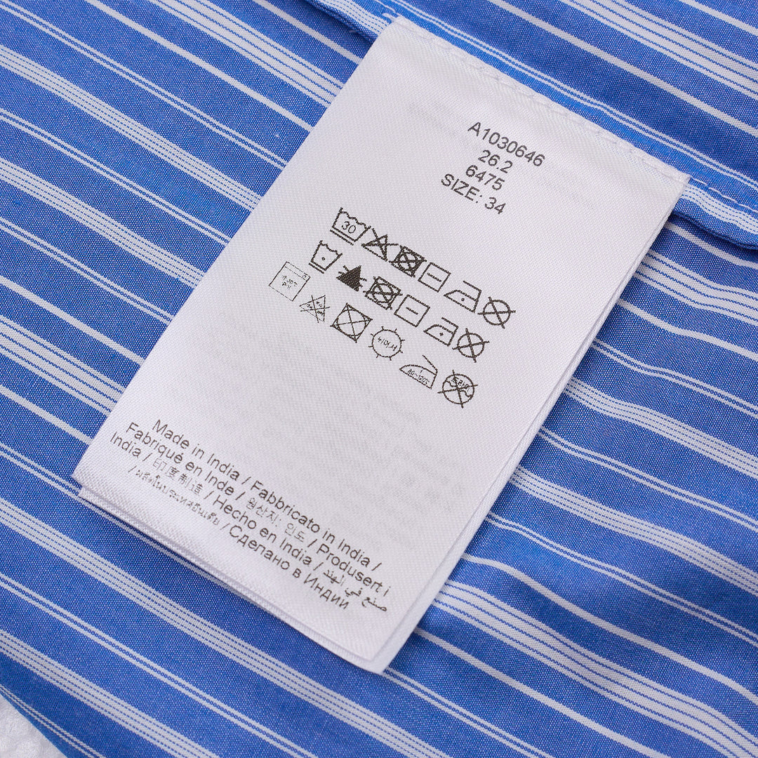 Ganni blue and white striped cotton smocked midi dress with short puff sleeves and a full pleated skirt, shown on a ghost mannequin against a white background