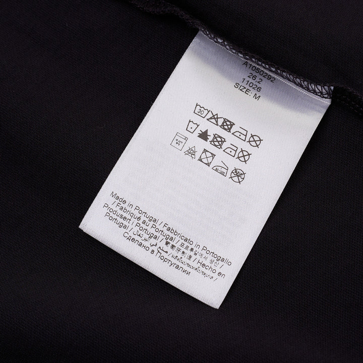 Ganni navy cotton jersey t-shirt with oversized strawberry and daisy graphic print, blue grunge-style Ganni logo, and 'Have a nice day! Please recycle' slogan on the front