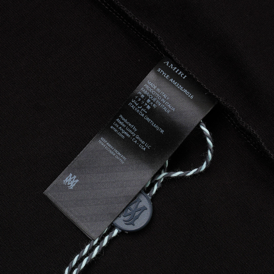 Amiri Crystal Gradient Hollywood Tee in black, featuring an oversized fit and a shimmering blue crystal-embellished 'Amiri Hollywood' graphic across the chest