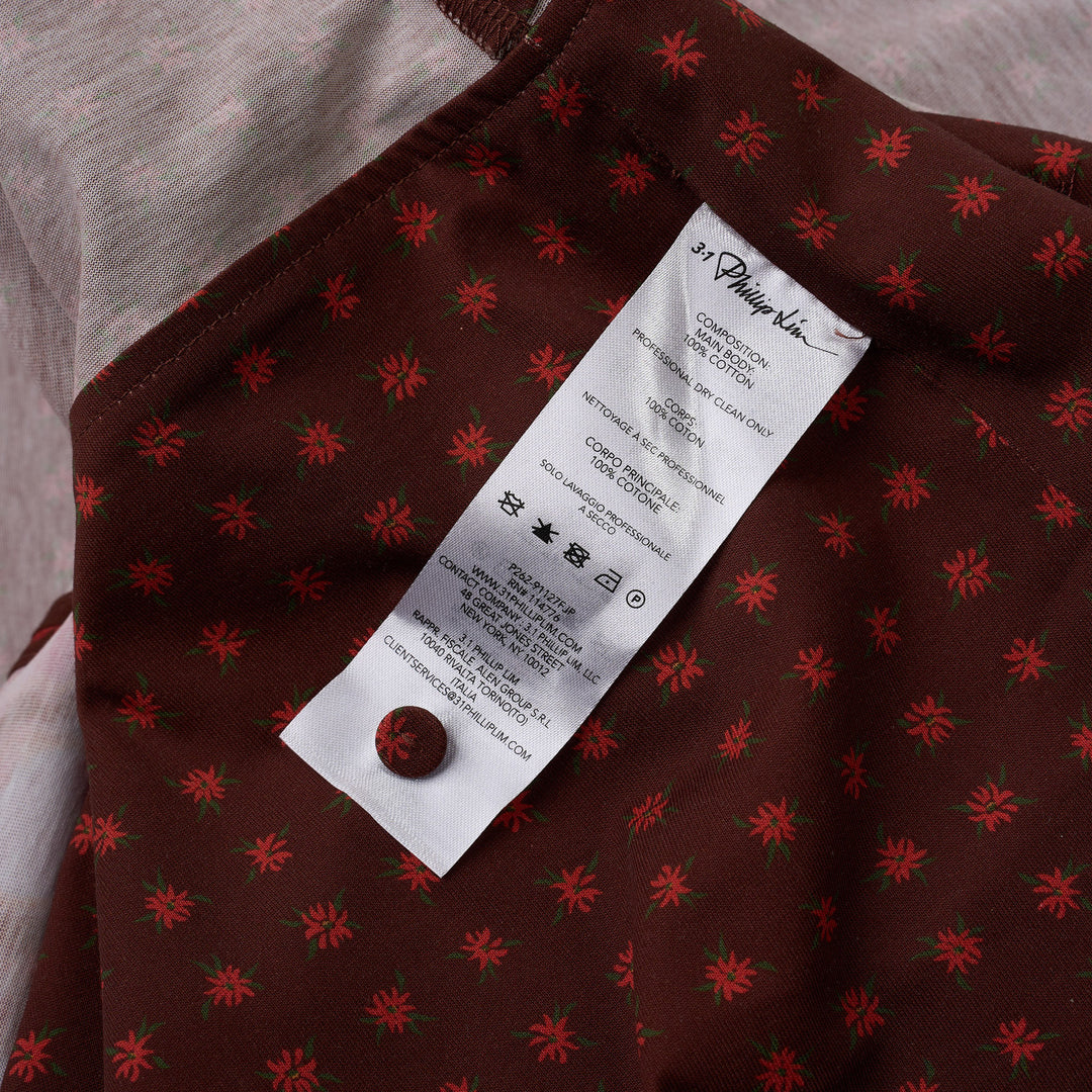 3.1 Phillip Lim Desert Flower Twist Dress in burgundy with abstract floral and polka-dot mixed print, gathered knot waist, asymmetric fringe hem, and cap sleeves