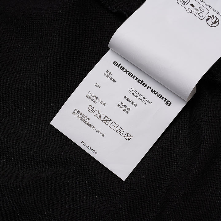 Alexander Wang black twisted bust layered mini dress with ruched bodice, cap sleeves, and double-hem finish, displayed on a white background