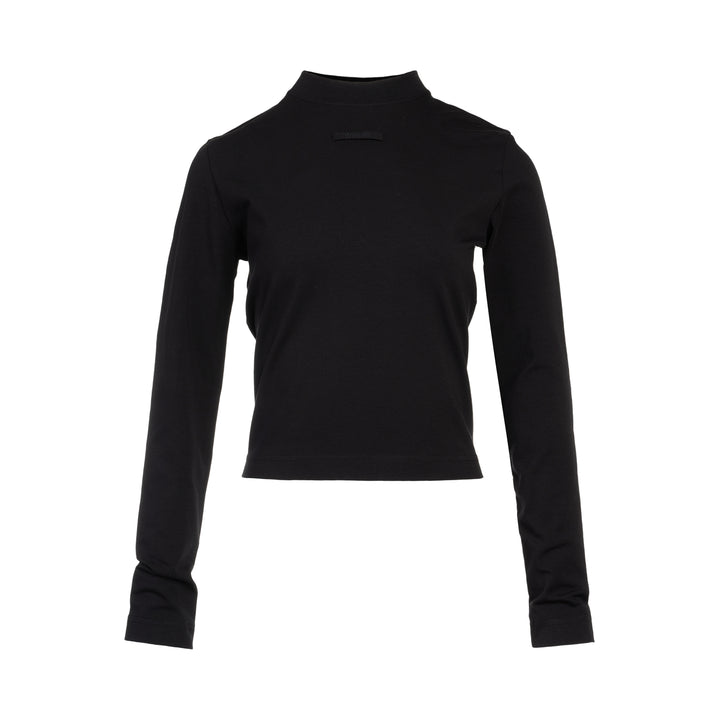 Jacquemus Gros Grain Long Sleeve Tee in black — cropped mock-neck jersey top with tonal grosgrain logo label at the chest, photographed flat on a white background