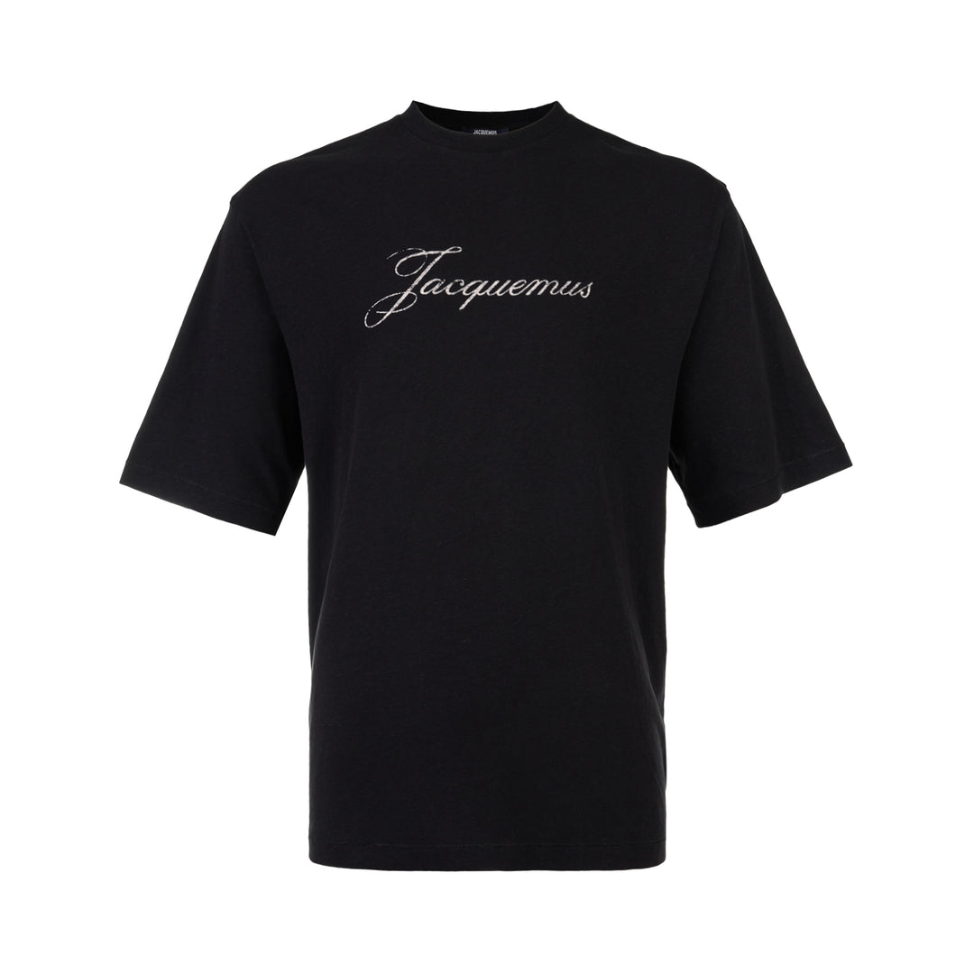 Jacquemus black oversized short sleeve crew neck tee with cursive embroidered Jacquemus logo across the chest