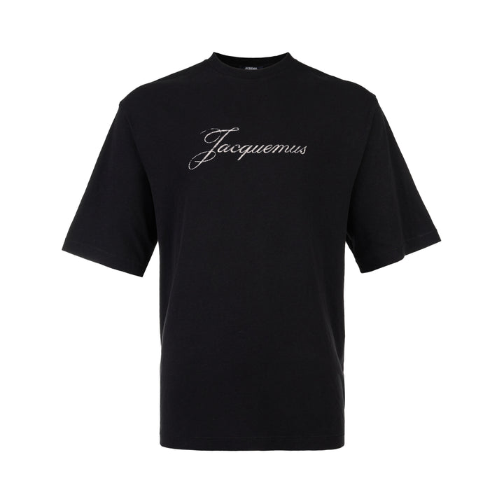 Jacquemus black oversized short sleeve crew neck tee with cursive embroidered Jacquemus logo across the chest