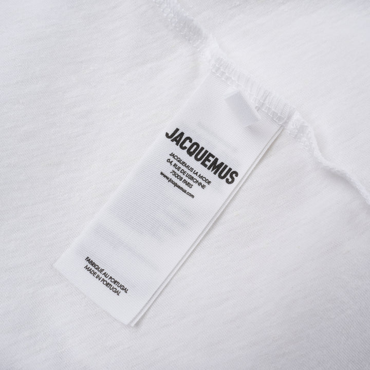Jacquemus black oversized short sleeve crew neck tee with cursive embroidered Jacquemus logo across the chest