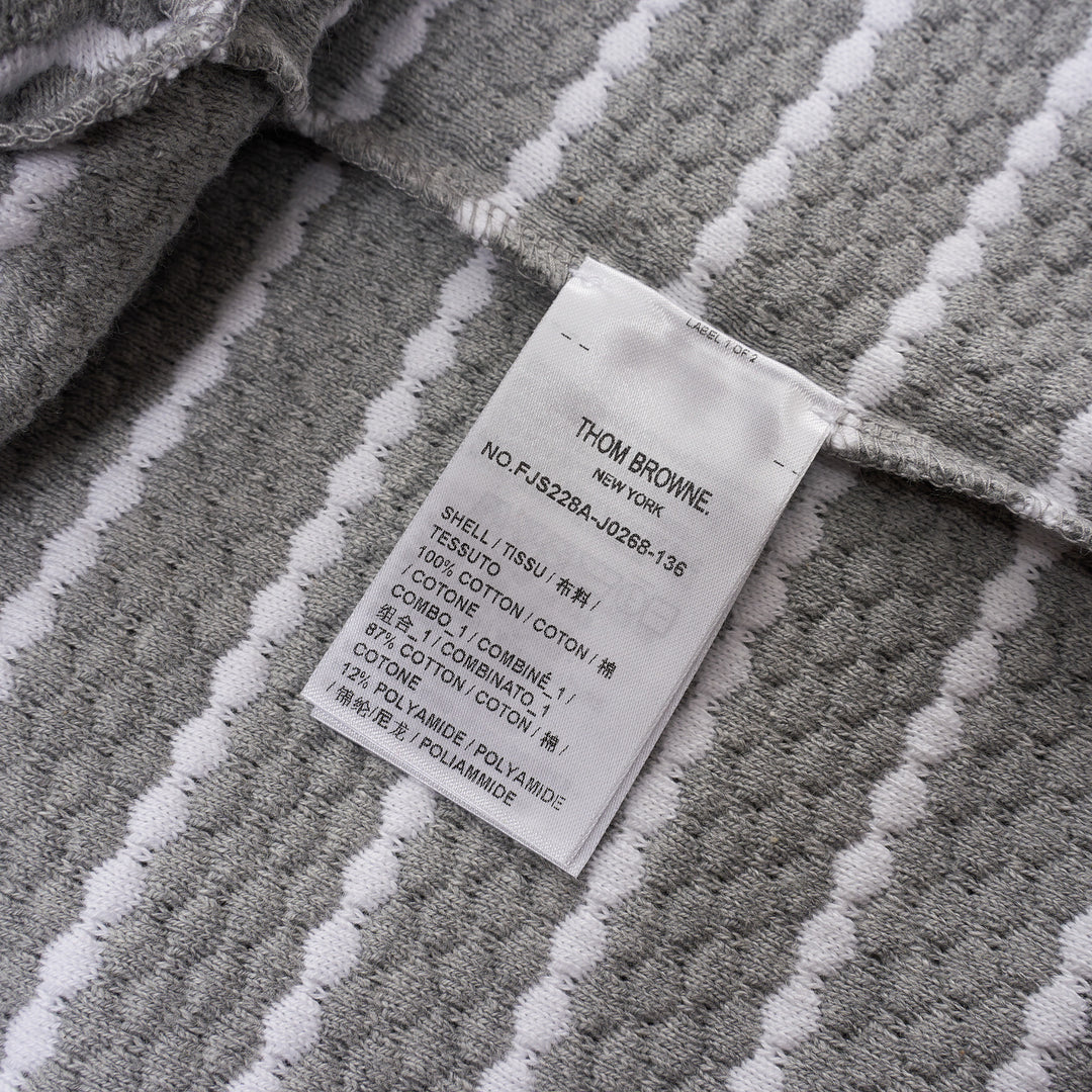 Thom Browne grey and white horizontal stripe rib short sleeve tee with contrast white crew neck, cuff, and hem trims, and a woven Thom Browne New York label at the front - view 3