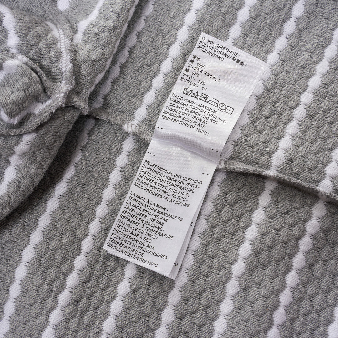 Thom Browne grey and white horizontal stripe rib short sleeve tee with contrast white crew neck, cuff, and hem trims, and a woven Thom Browne New York label at the front - view 4