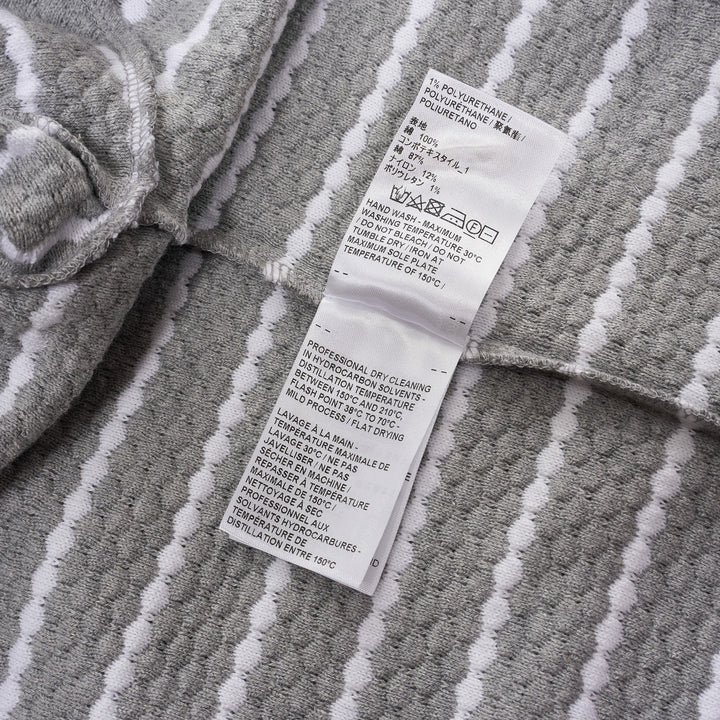Thom Browne grey and white horizontal stripe rib short sleeve tee with contrast white crew neck, cuff, and hem trims, and a woven Thom Browne New York label at the front - view 4