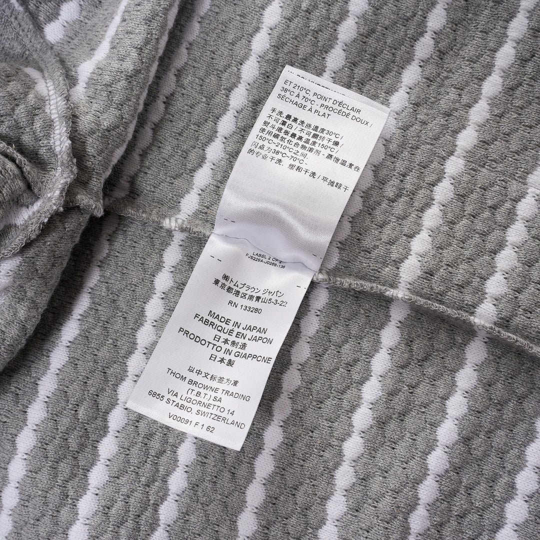Thom Browne grey and white horizontal stripe rib short sleeve tee with contrast white crew neck, cuff, and hem trims, and a woven Thom Browne New York label at the front - view 5