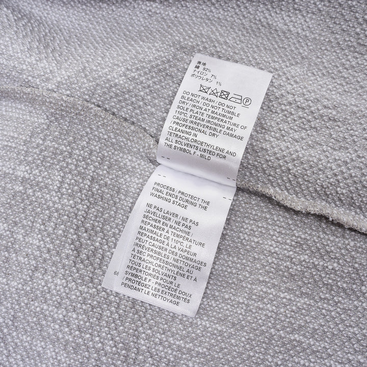 Thom Browne heather grey textural knit short sleeve tee with red, white, and blue striped tipping on sleeve cuffs and hem, white ribbed crew neck and hem band, and woven brand label on chest - view 4