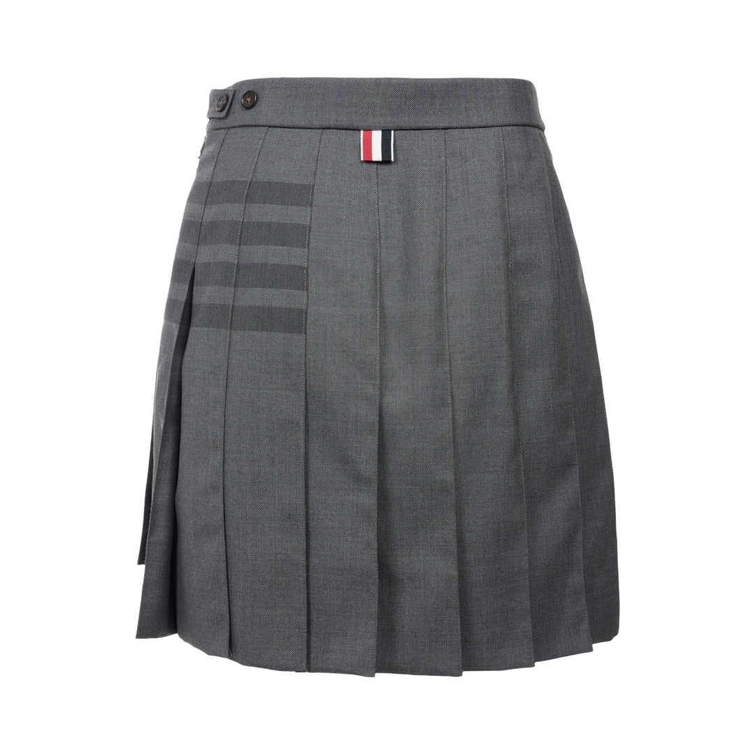 Thom Browne grey pleated mini skirt with tonal 4-bar stripe on one panel and red, white, and blue grosgrain tab at hem - view 2