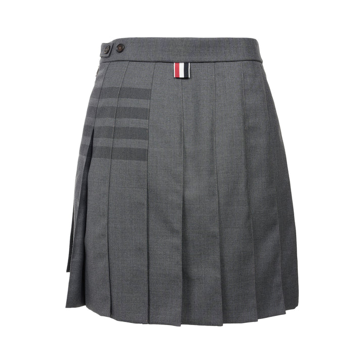 Thom Browne grey pleated mini skirt with tonal 4-bar stripe on one panel and red, white, and blue grosgrain tab at hem - view 2
