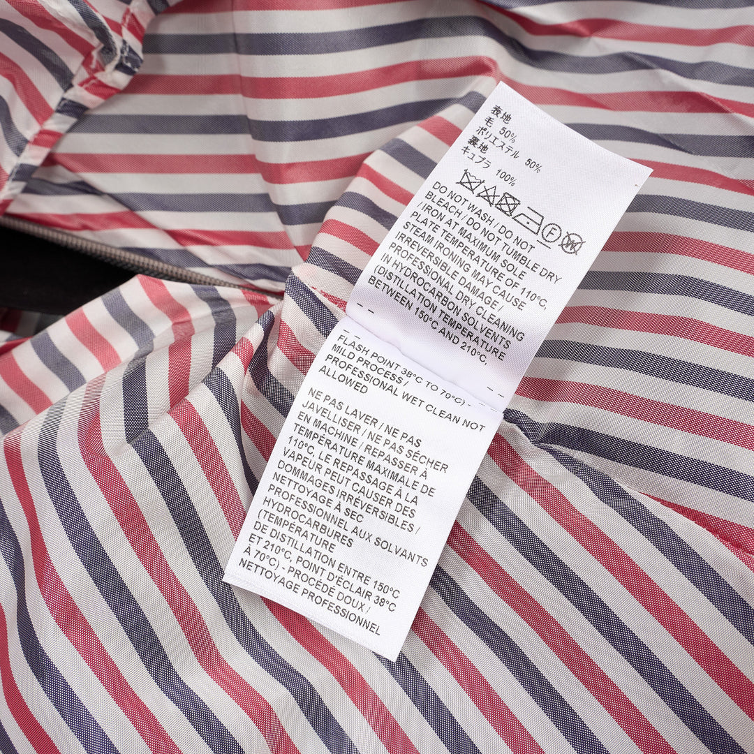 Thom Browne grey pleated mini skirt with tonal 4-bar stripe on one panel and red, white, and blue grosgrain tab at hem - view 4