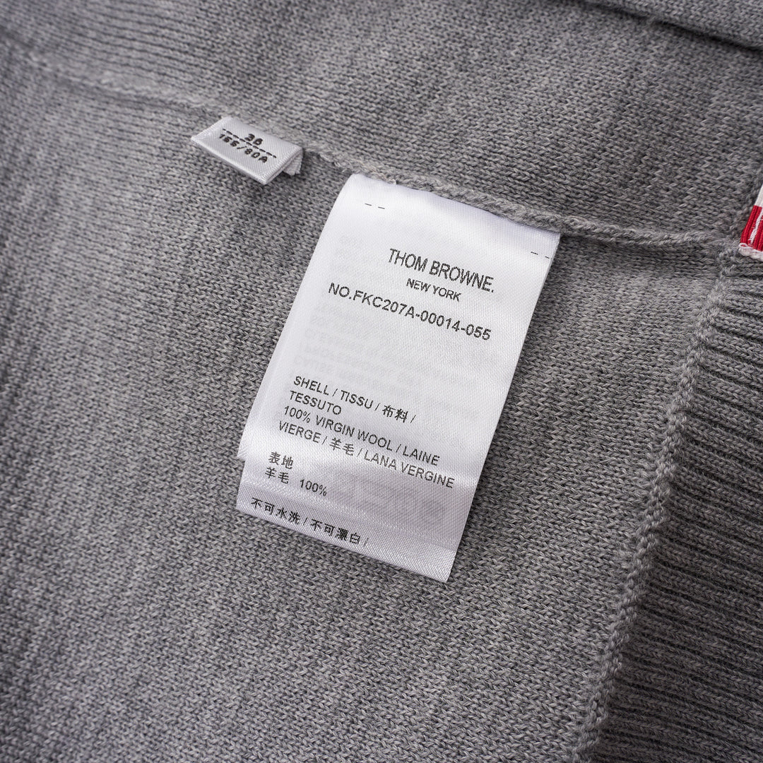 Thom Browne heather grey V-neck cardigan with four-bar white stripe detail on sleeve, button-through front, and ribbed hem and cuffs - view 3