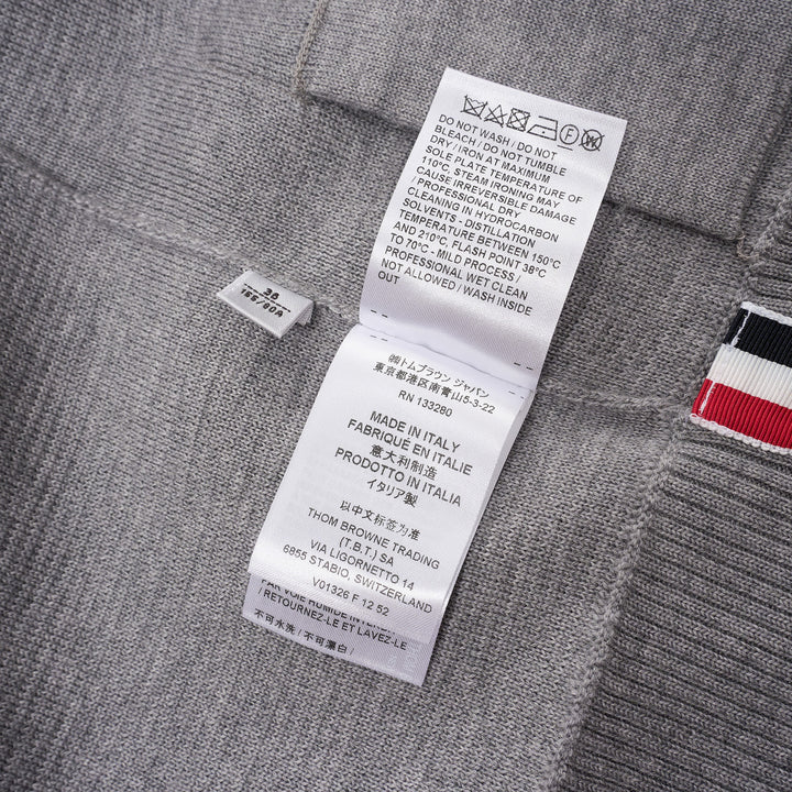 Thom Browne heather grey V-neck cardigan with four-bar white stripe detail on sleeve, button-through front, and ribbed hem and cuffs - view 4