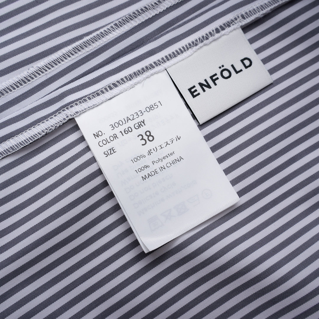 Enfold Striped Flutter Sleeve Box Dress in navy and white pinstripe, featuring cape-style flutter sleeves and a relaxed cocoon silhouette, shot flat on a white background