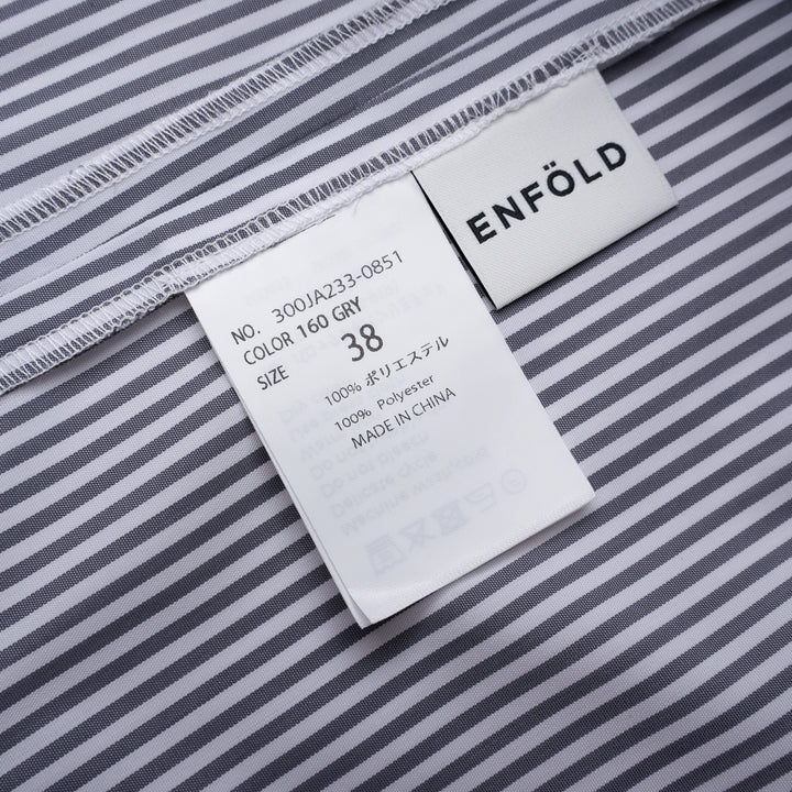 Enfold Striped Flutter Sleeve Box Dress in navy and white pinstripe, featuring cape-style flutter sleeves and a relaxed cocoon silhouette, shot flat on a white background