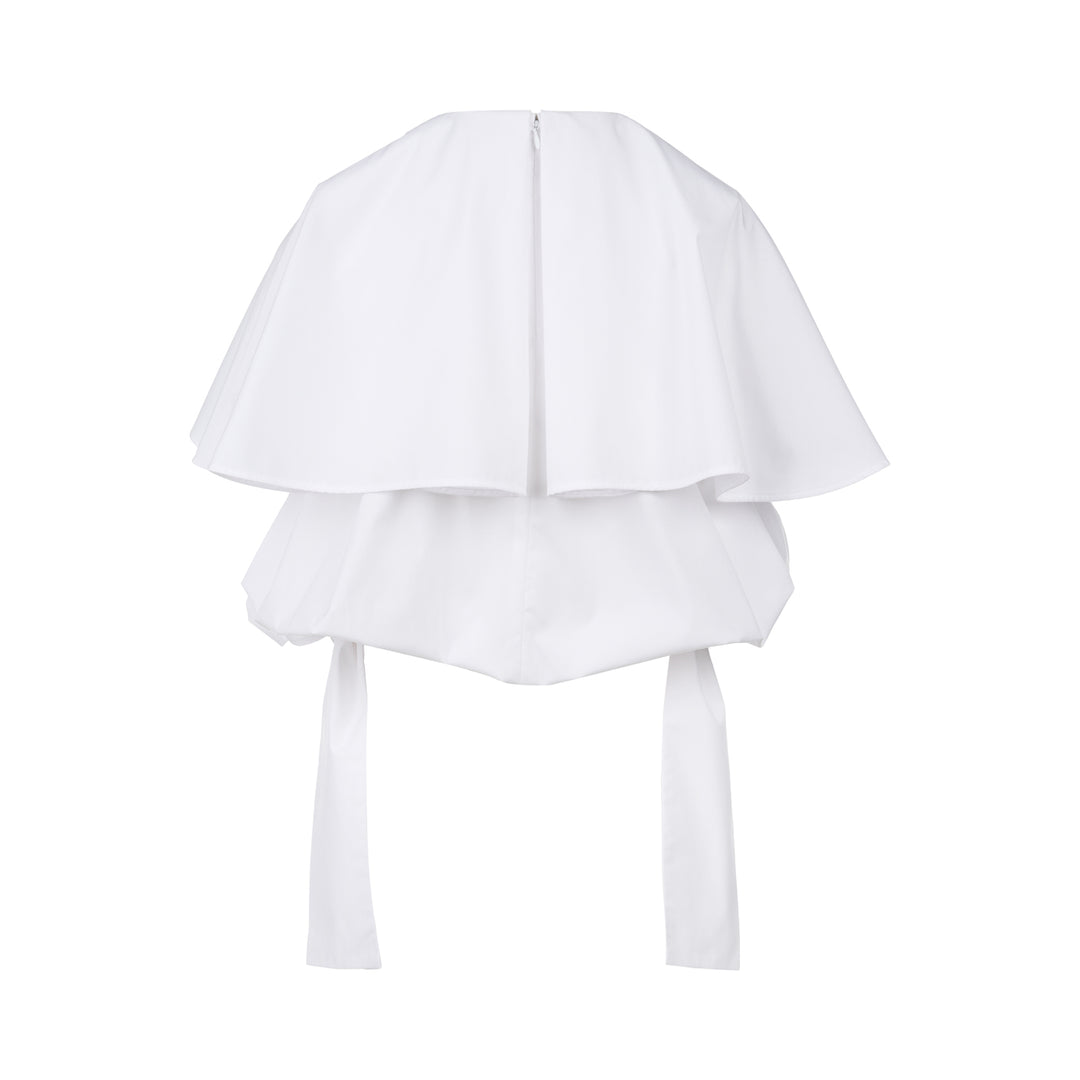 Enfold Big Collar Layered Blouse in white, rear view showing tiered cape collar, voluminous peplum hem, back zip closure, and long self-fabric waist ties