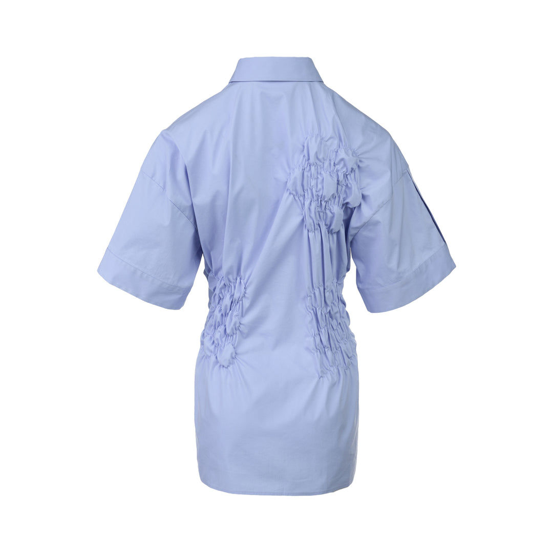 Enfold Shirring Detail Short Sleeve Shirt in periwinkle blue with elasticated smocked waist panel and mother-of-pearl buttons, front view on white background