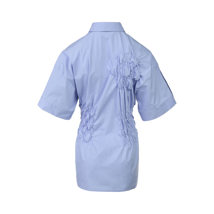 Enfold Shirring Detail Short Sleeve Shirt in periwinkle blue with elasticated smocked waist panel and mother-of-pearl buttons, front view on white background