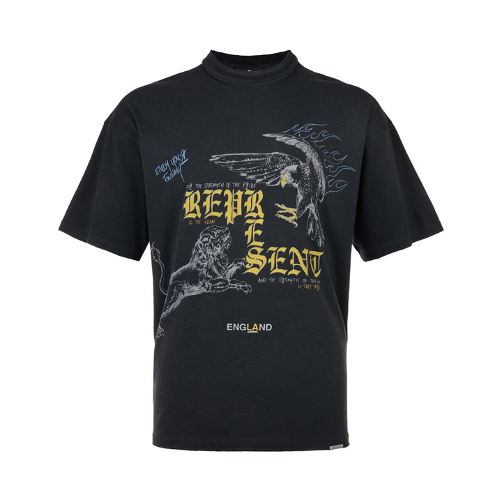 Represent Enemy Tee in washed black, featuring oversized gothic 'Represent' lettering, a hand-drawn lion and diving eagle illustration, blue flame detailing, and 'England' branding on heavyweight cotton