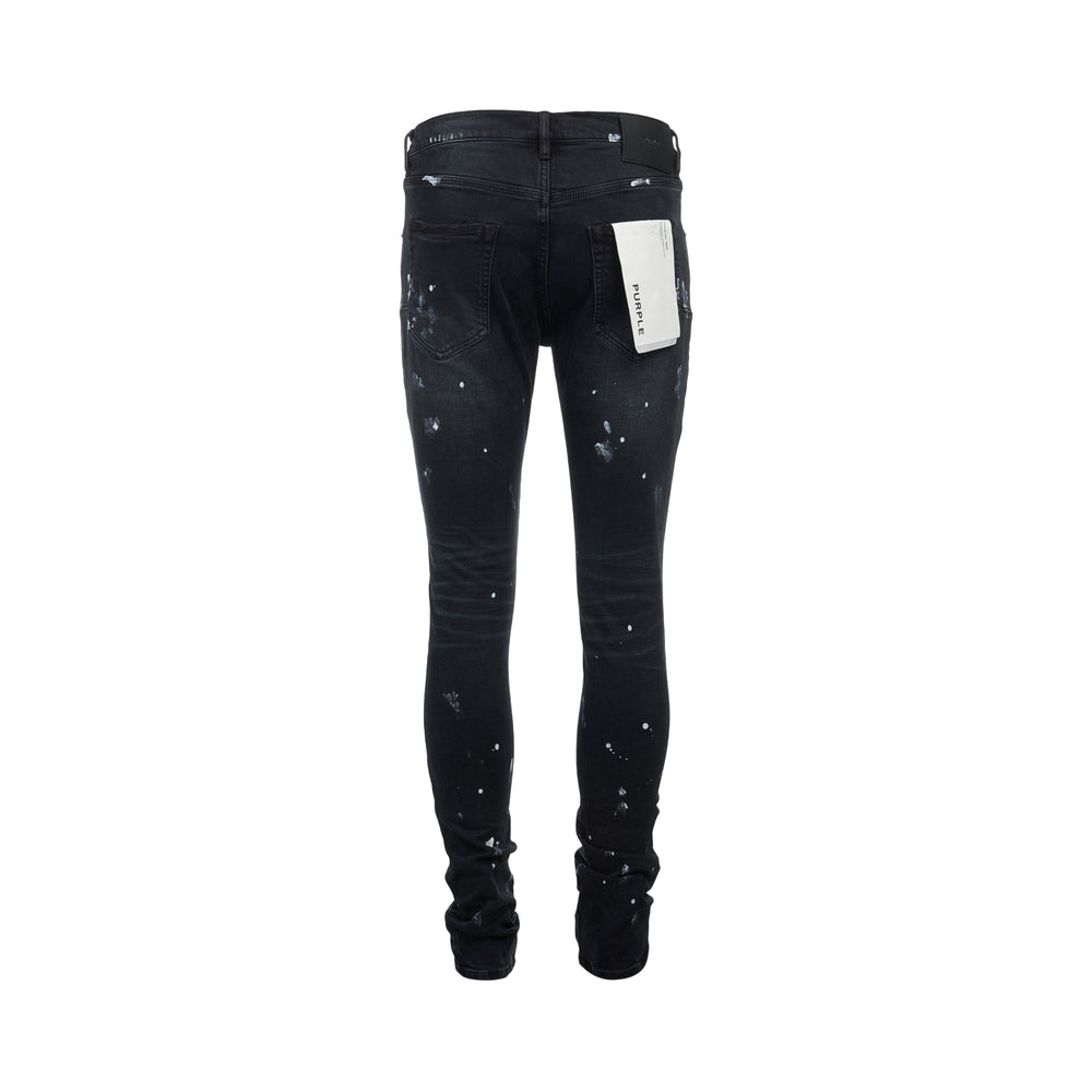 Purple Black Resin Knee Slit Jeans in faded black denim with paint splatter detailing, blown-out knee distressing, and stacked hem, front view - view 2