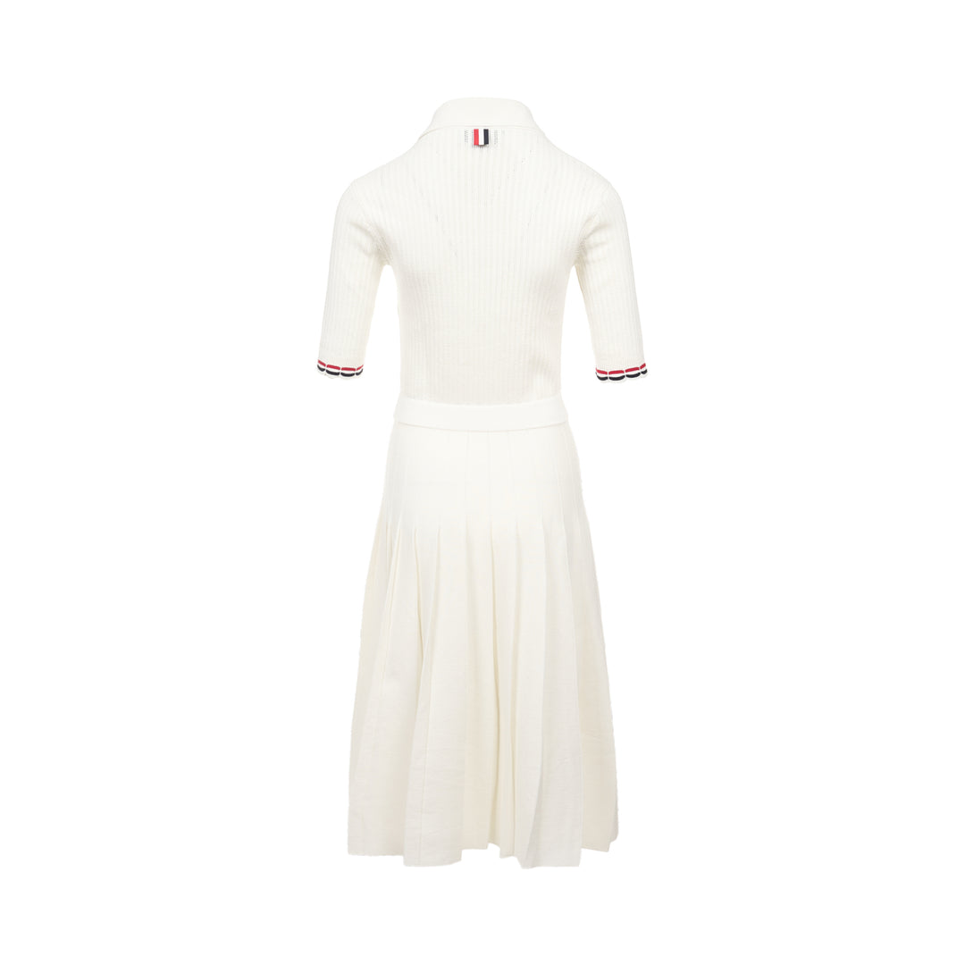 Thom Browne below knee polo dress in ivory ribbed knit with pleated skirt, silver-tone button placket, and signature red, white, and blue stripe cuff trim - view 2