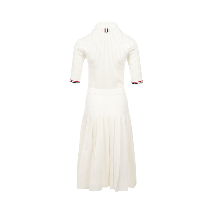 Thom Browne below knee polo dress in ivory ribbed knit with pleated skirt, silver-tone button placket, and signature red, white, and blue stripe cuff trim - view 2