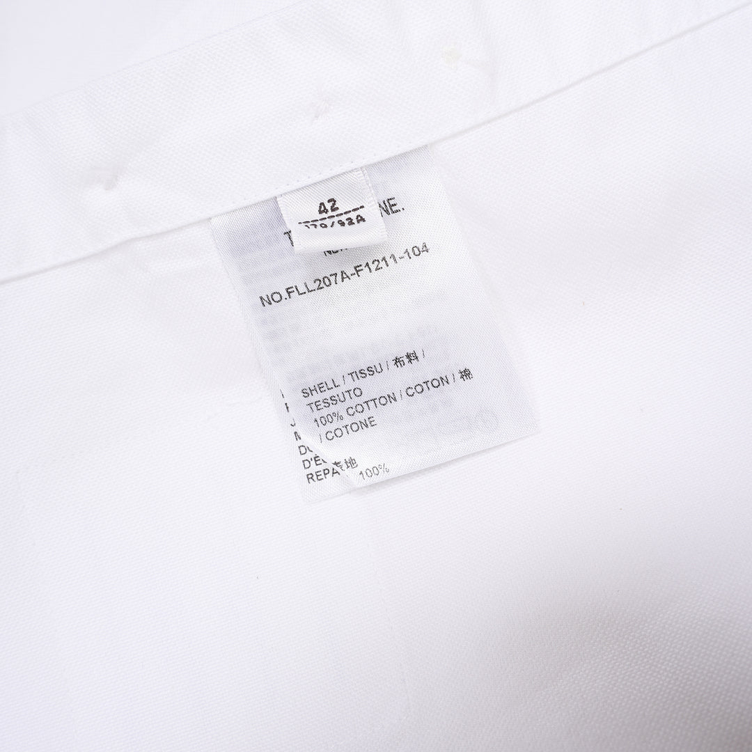 Thom Browne white oxford long sleeve shirt with rounded collar, button-front placket, single chest pocket, and signature four-bar grey stripe across one sleeve - view 3