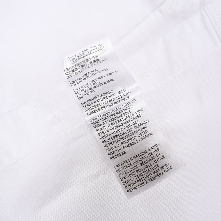 Thom Browne white oxford long sleeve shirt with rounded collar, button-front placket, single chest pocket, and signature four-bar grey stripe across one sleeve - view 4