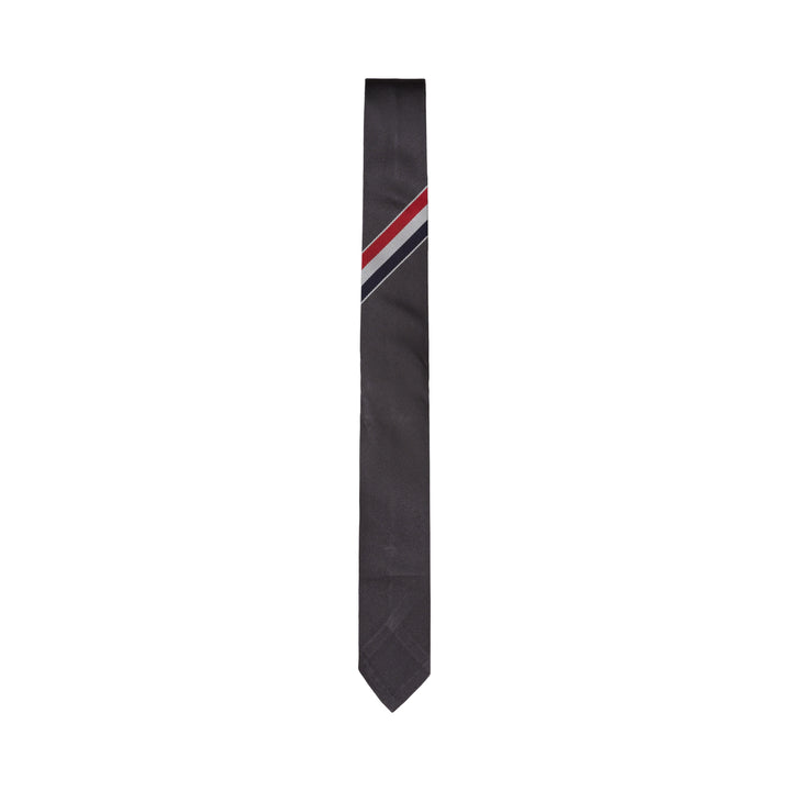 Thom Browne charcoal grey silk tie with diagonal red, white, and blue stripe