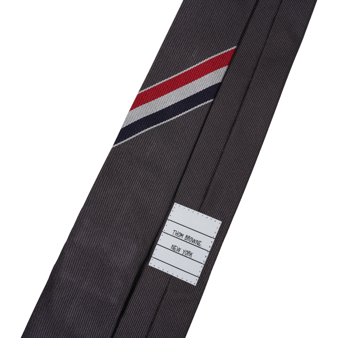 Thom Browne charcoal grey silk tie with diagonal red, white, and blue stripe - view 3