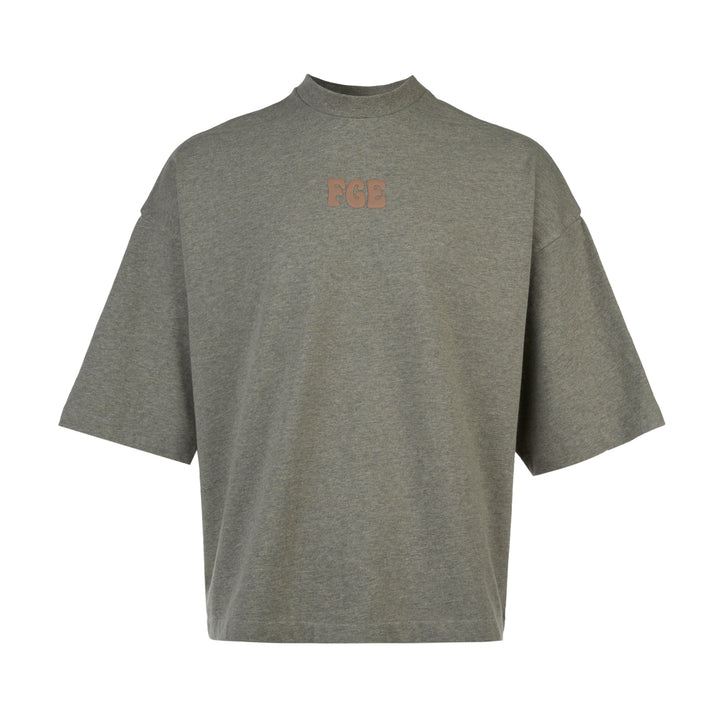 Fear of God Essentials FGE Mock Neck Tee in washed charcoal, featuring an oversized boxy silhouette, dropped shoulders, half-length sleeves, and tonal FGE chest branding