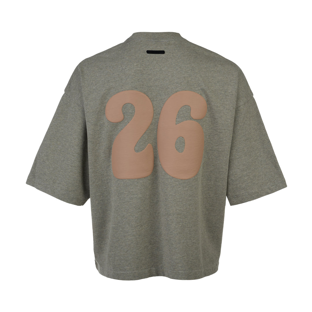Fear of God Essentials FGE Mock Neck Tee in washed charcoal, featuring an oversized boxy silhouette, dropped shoulders, half-length sleeves, and tonal FGE chest branding