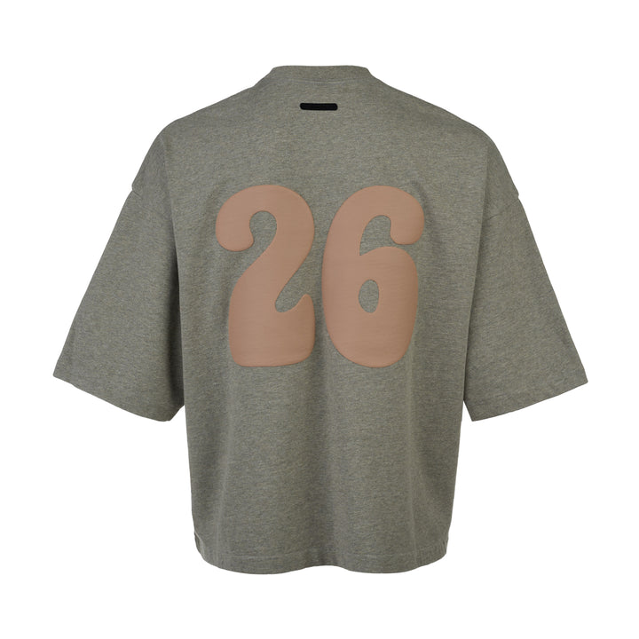 Fear of God Essentials FGE Mock Neck Tee in washed charcoal, featuring an oversized boxy silhouette, dropped shoulders, half-length sleeves, and tonal FGE chest branding