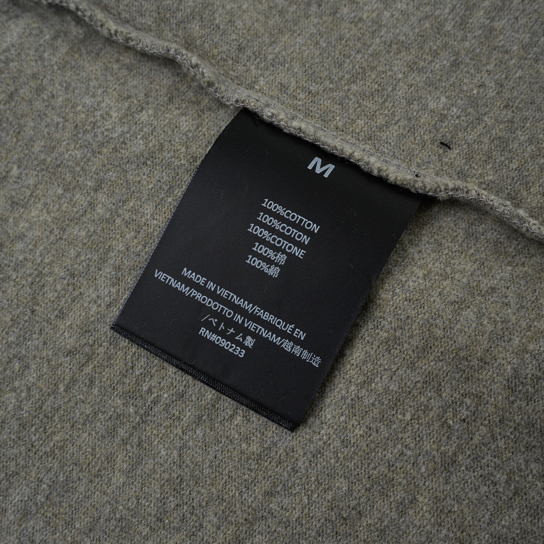 Fear of God Essentials FGE Mock Neck Tee in washed charcoal, featuring an oversized boxy silhouette, dropped shoulders, half-length sleeves, and tonal FGE chest branding