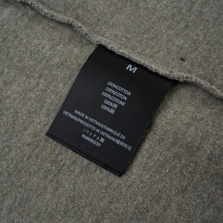 Fear of God Essentials FGE Mock Neck Tee in washed charcoal, featuring an oversized boxy silhouette, dropped shoulders, half-length sleeves, and tonal FGE chest branding